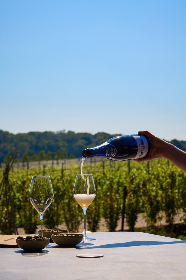 A bottle of hambledon Classic Cuvee Brut sparkling english wine be poured