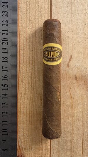Jose L Piedra Petit Caballeros Cuban cigar showing its compact format and natural wrapper