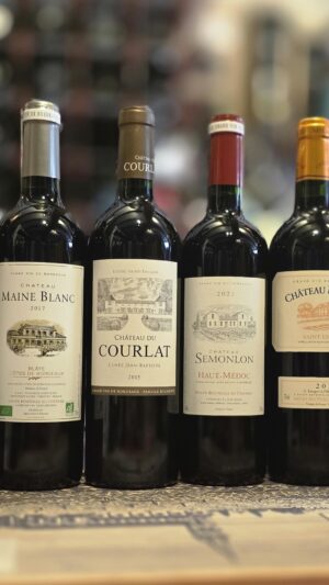 Bordeaux Wine Month 2026 mixed case featuring six bottles of French red and white wine from Fareham Wine Cellar,Chateau Lestage La Mouette Bordeaux Blanc 2020 white wine bottle,Chateau Maine Blanc 2017 Blaye Cotes de Bordeaux red wine bottle,Chateau Du Courlat Cuvee Jean-Baptiste Lussac Saint-Emilion 2015 red wine bottle,Chateau Semonlon Haut-Medoc AC 2021 red wine bottle,Chateau Merville 2014 Saint-Estephe red wine bottle